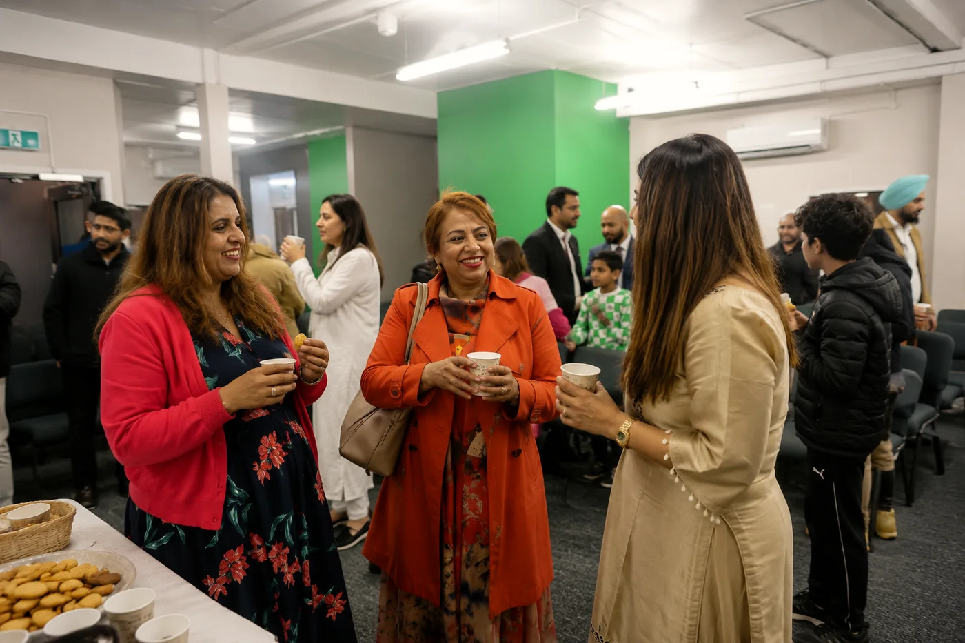 Members of the congregation sharing chai and snacks together after a Sunday service