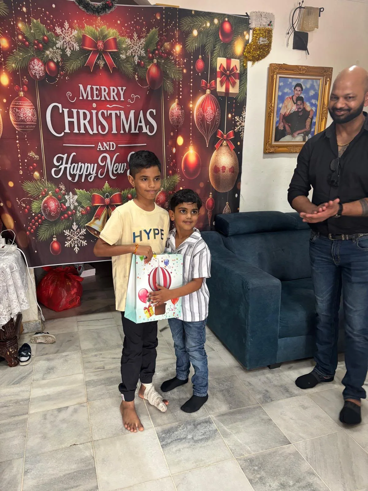 Two boys receiving a Christmas gift