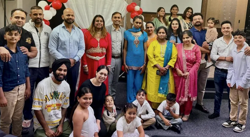 The whole church family gathered together, children at the front