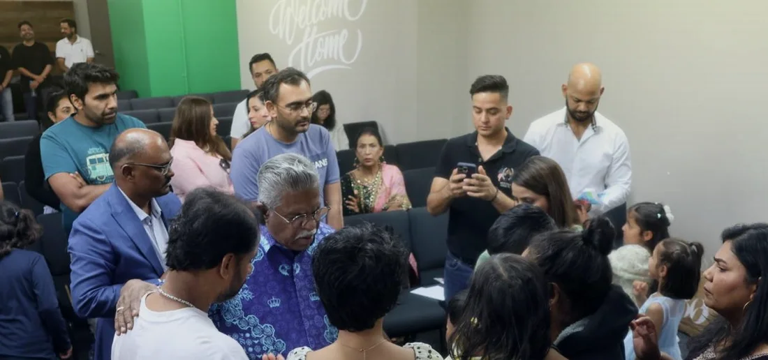 The congregation praying together during a service