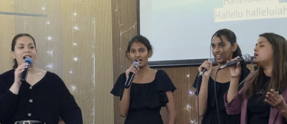 The worship team singing together