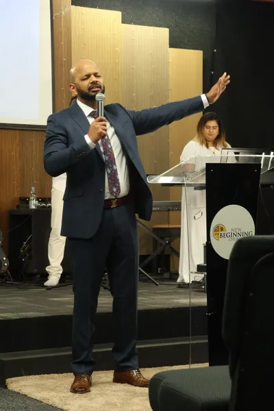 Pastor Vikas sharing a message during worship