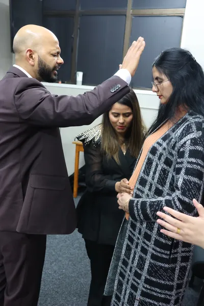 Laying hands in prayer during the service