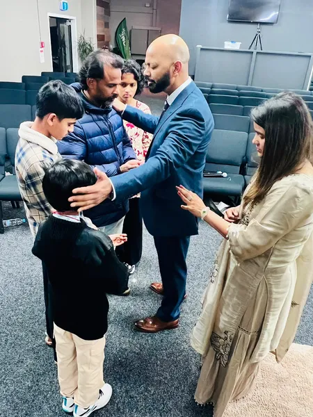 Praying a blessing over a whole family