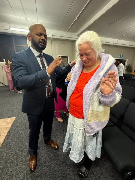 Praying over an elder of the church