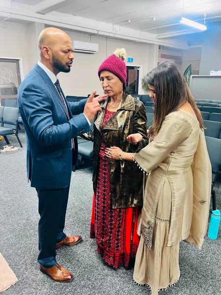 Praying with one another after worship