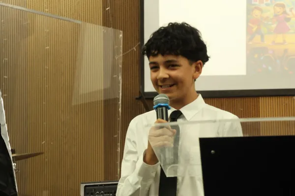 A youth speaking during the Sunday service