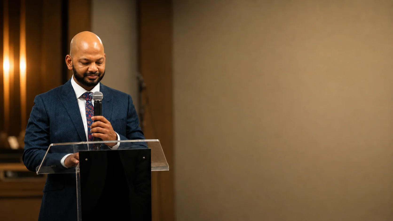 Pastor Vikas teaching from the lectern