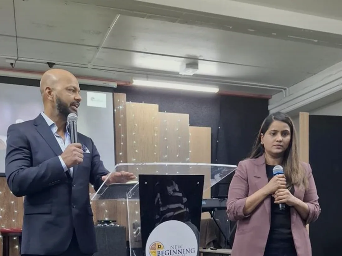 Two of the church leaders on stage during a service